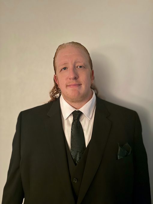 Lance W. Fisher in a suit